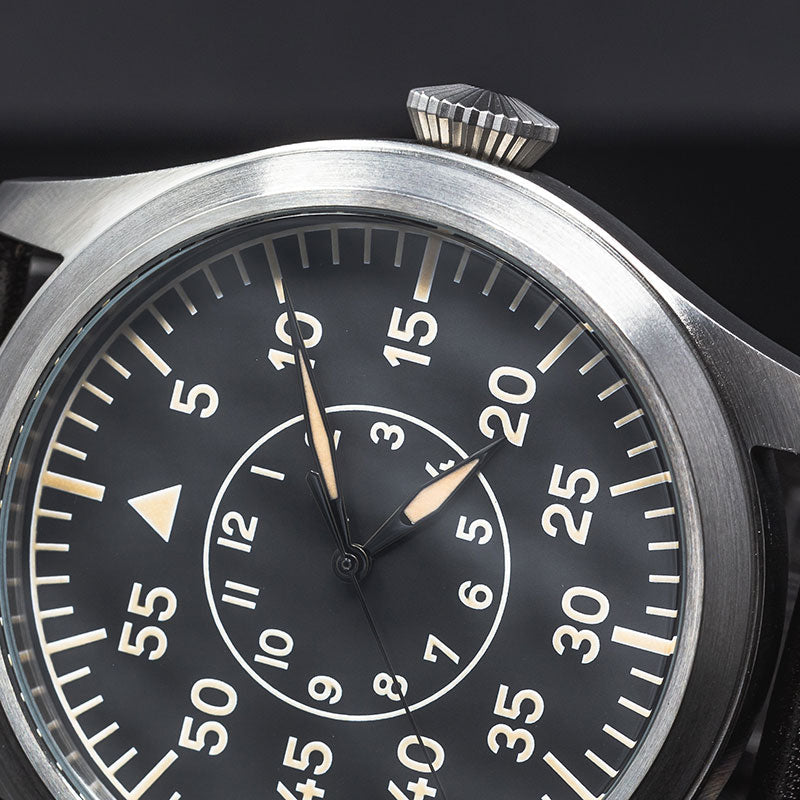 Enoksen Fly-E03B seen from front. Close up of dial. Watch tilted with crown on top.